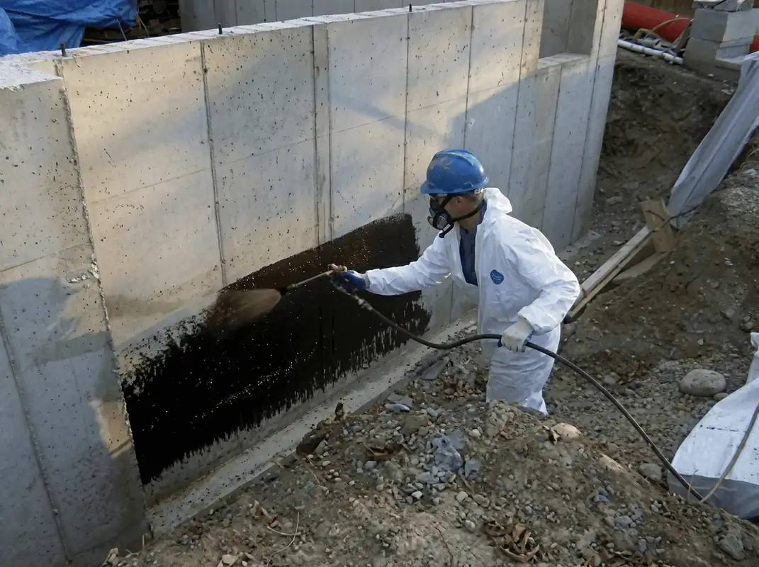 Professional waterproofing the exterior walls of the basement in Sioux Falls, SD