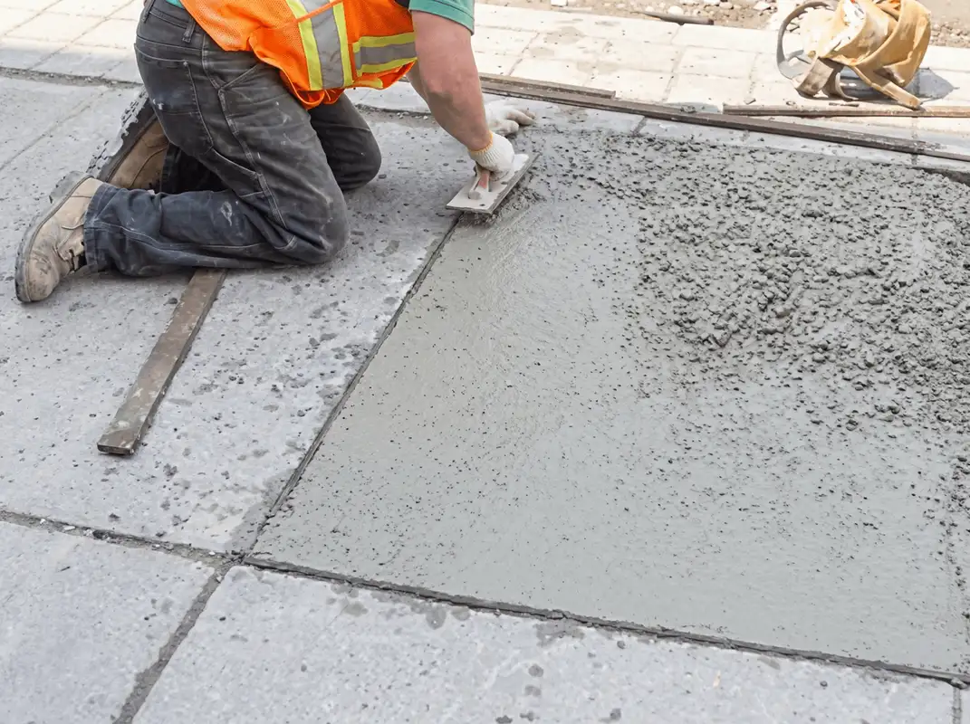Professional repairing a concrete floor in Sioux Falls, SD