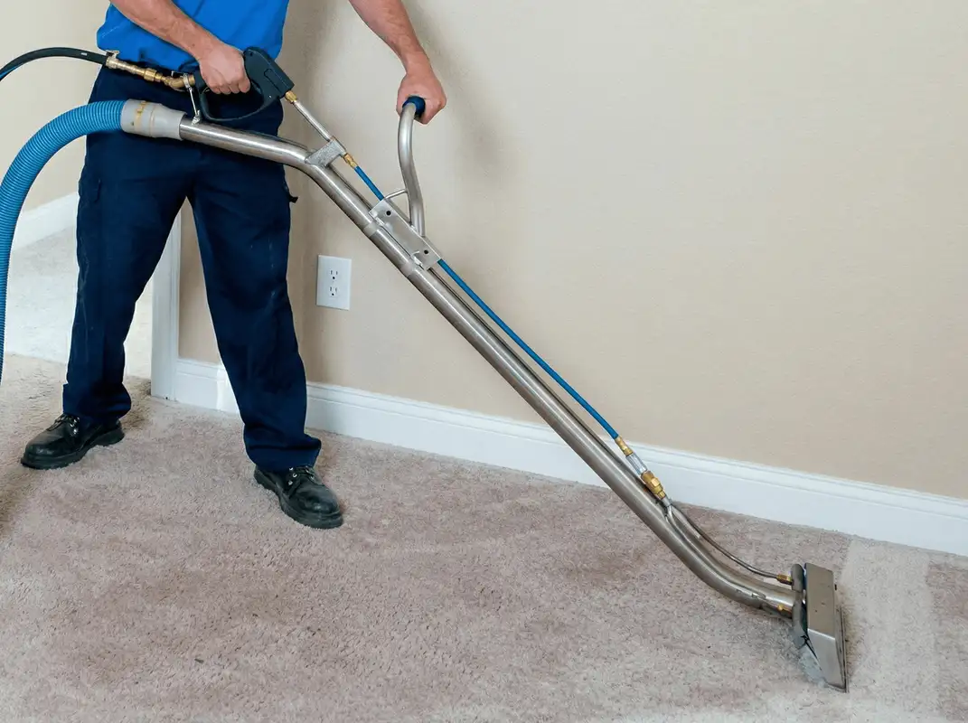 Professional operating a liquid removal machine on a carpeted floor in Sioux Falls, SD